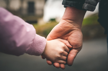 parent and child holding hands