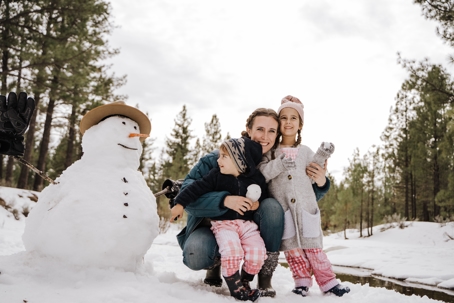 mother and children in snow