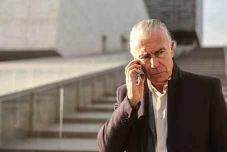 concerned looking older man on phone