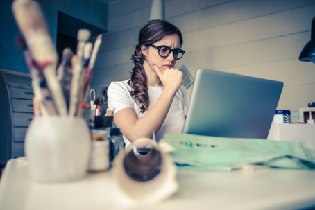 woman working on laptop in studio