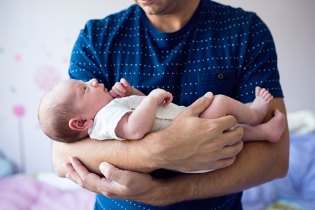 man holding baby